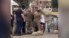 Why are Ukraine's military recruiters facing violence in their own country?