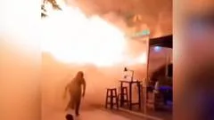 People flee Bangkok bar as huge flames shoot out from doorway