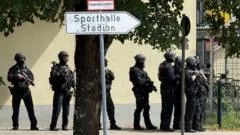 Teenager arrested after two girls, 13, seriously injured in German school attack