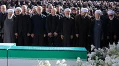 Iran's supreme leader absent as senior officials attend ayatollah's funeral