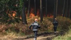 France fire crews face searing heat in battle to contain flames