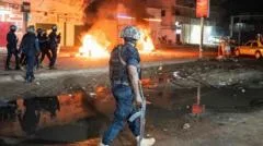 'You're not alone in the darkness': Gambia president urges calm after violent blackout protests